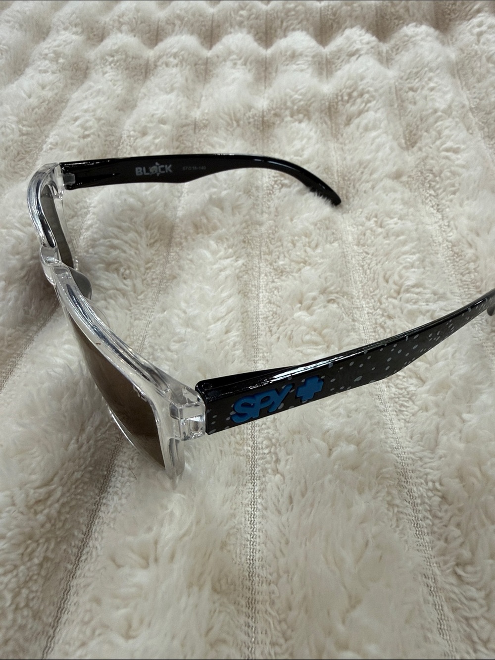 SPY Clear Frame Sunglasses with Black Temples and Blue Logo